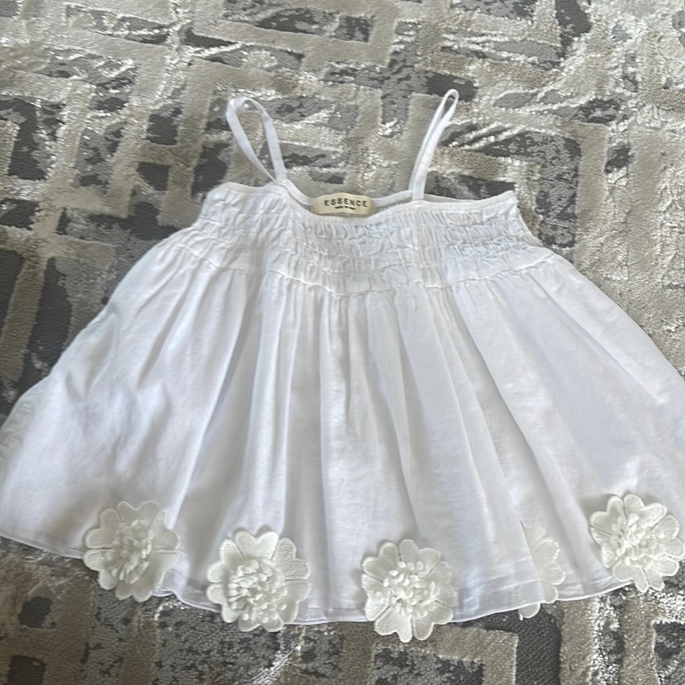 Girls white cotton top, size 6, with flower appliqués. Never worn, no tags.